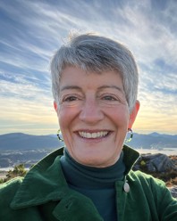 A  woman standing on a hill
