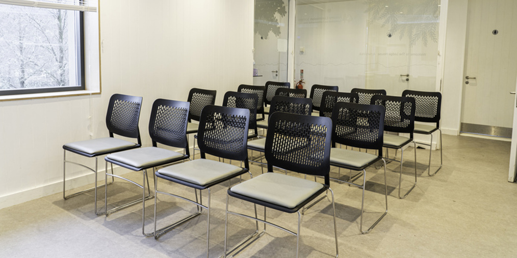 black chairs in a white room