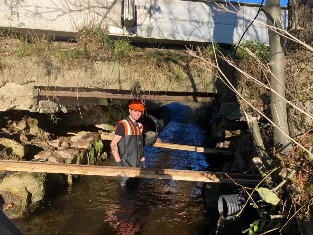 Civil Engineer standing under a bridge.