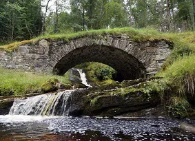 Waterfall running under the bridge at Achlain