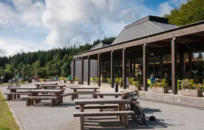 Picnic tables outside a visitor centre building