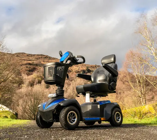 Mobility scooter on a gravel path.